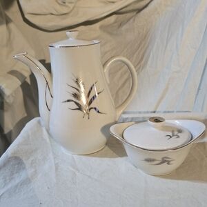 Elegant White Porcelain Tea Set with Silver Accents